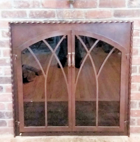 Taunton square to arch with twisted molding in ancient aged patina finish twin doors with standard forged handles smoked glass comes with slide mesh